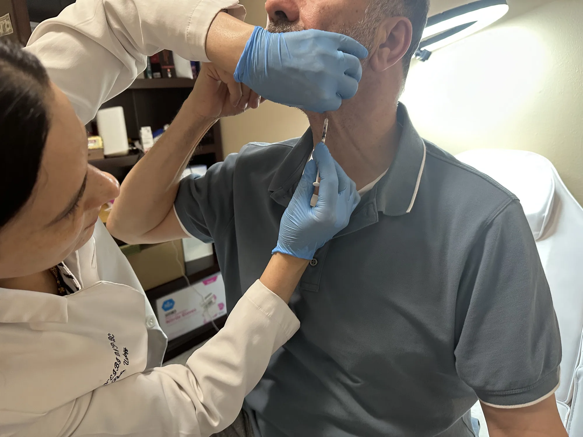 Dr. Nawal M. Qneibi treating a patient