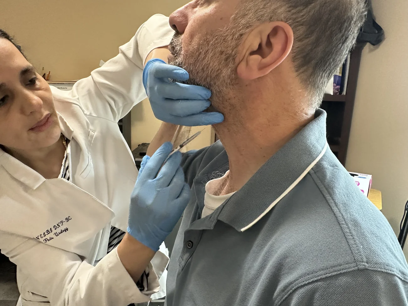 Dr. Nawal M. Qneibi treating a patient