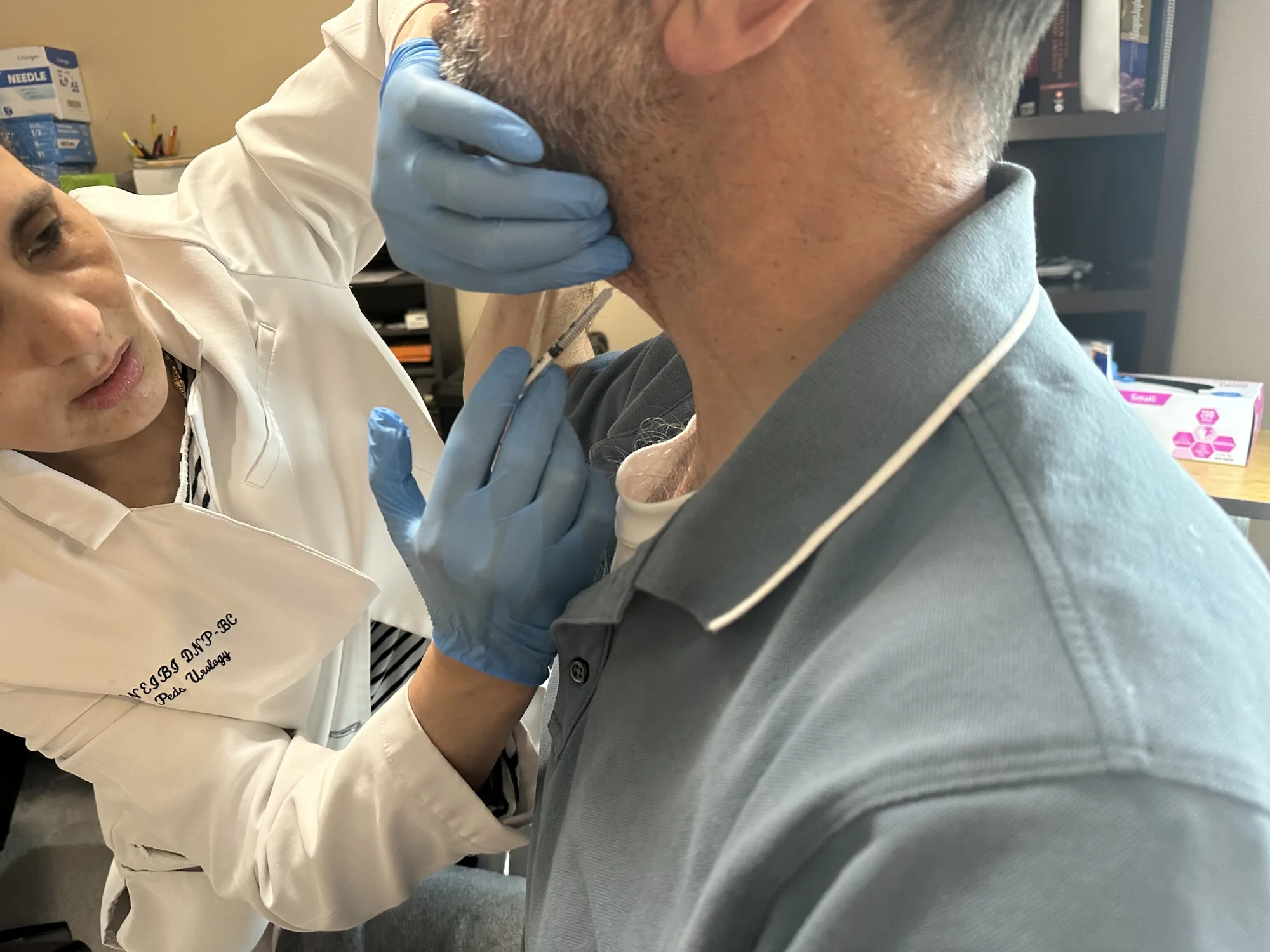 Dr. Nawal M. Qneibi treating a patient
