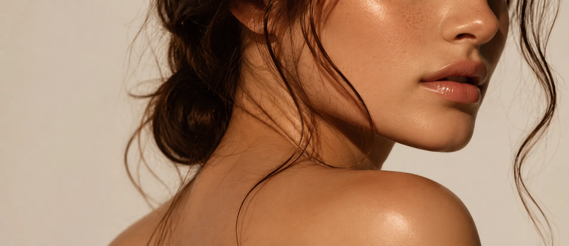 Close-up profile portrait of a woman&rsquo;s face, neck and shoulder
